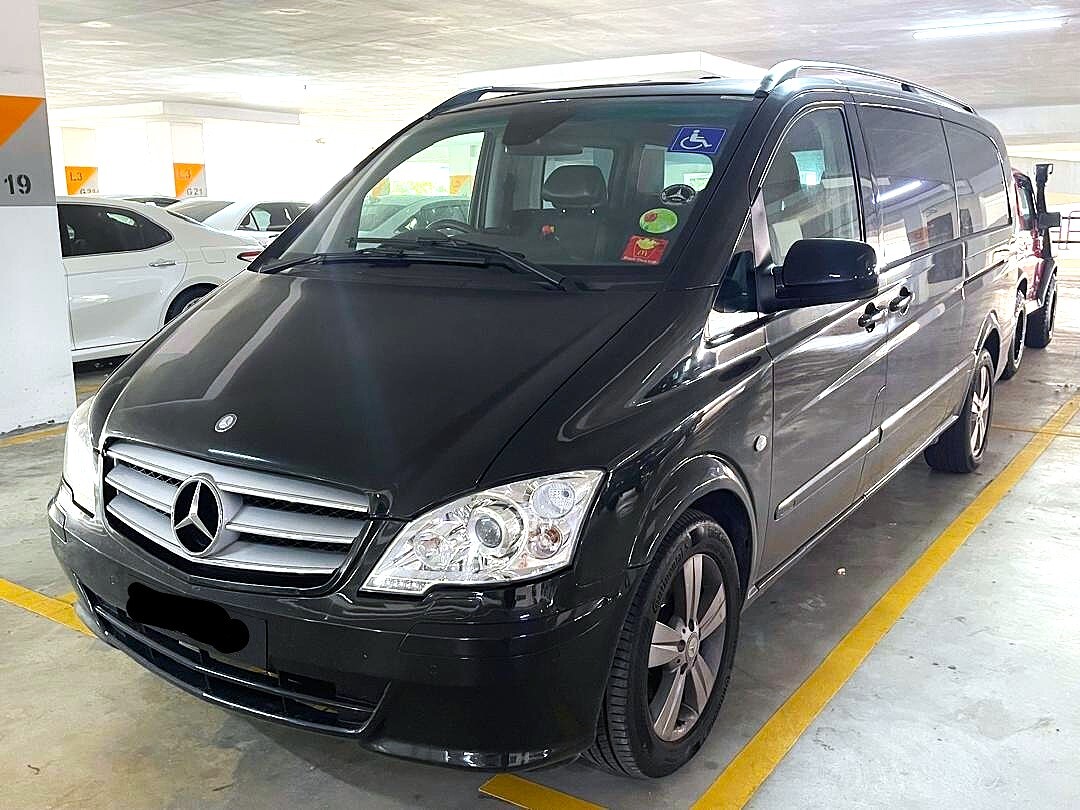 "Luxury black Mercedes-Benz V-Class van"