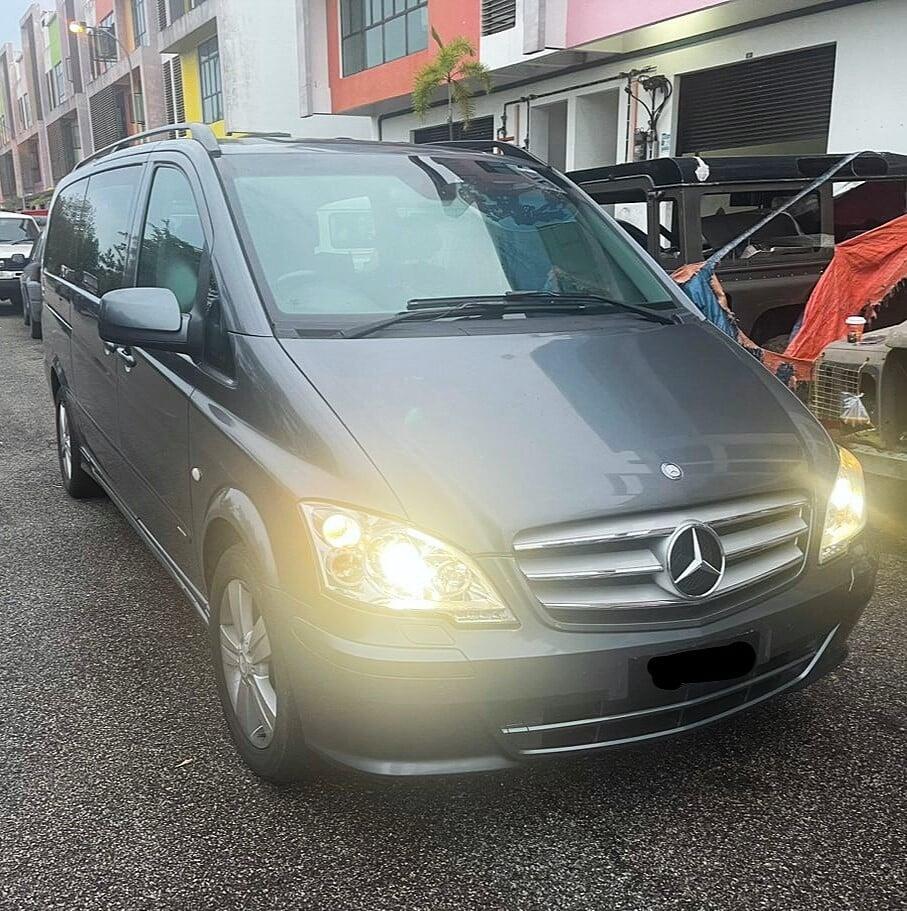 "Front side view of a luxury grey Mercedes-Benz V-Class van"